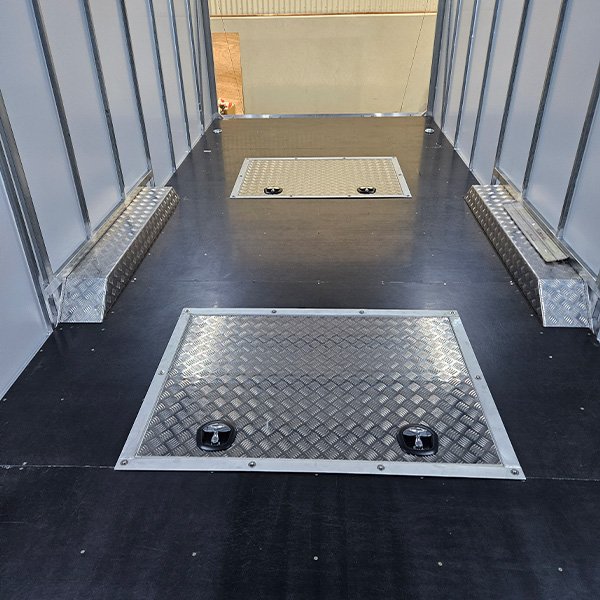 Underfloor trailer storage boxes.