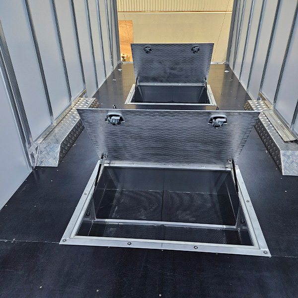 Underfloor trailer storage boxes.