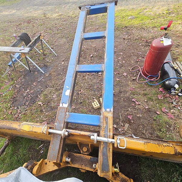 Customised tree pusher attachment for a bull dozer.