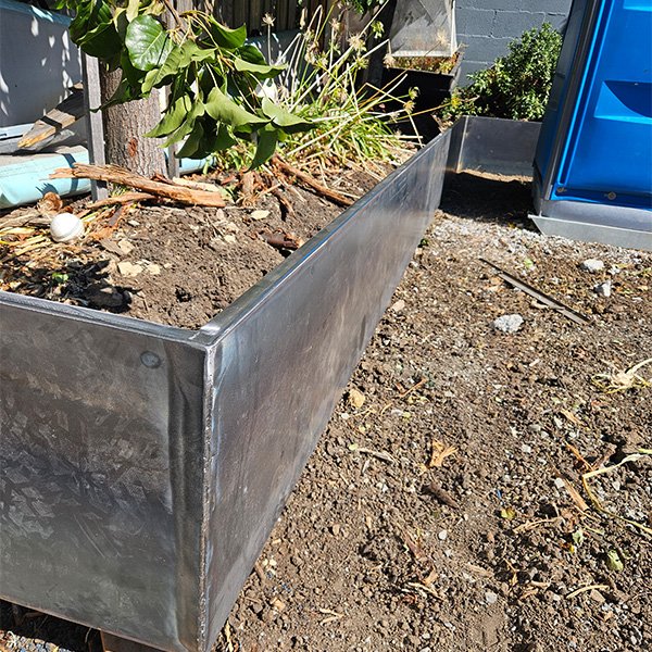 Custom raw steel garden edging, often known as Corten steel edging.