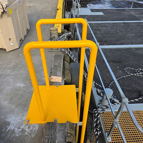 Safety access ladder for a marine pontoon.
