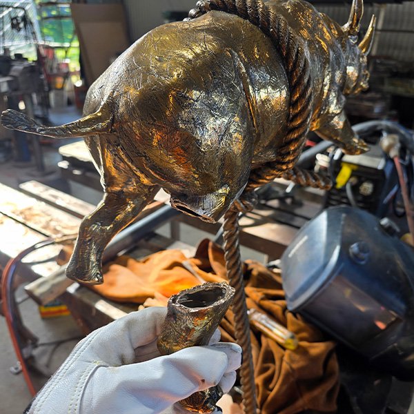 Welding repair to custom brass artwork.